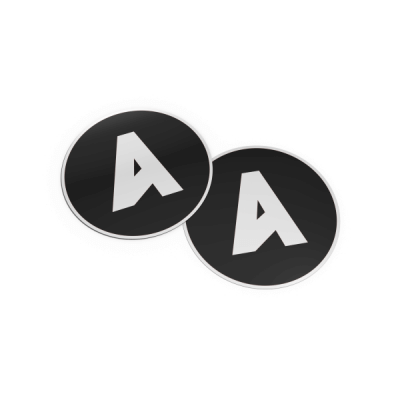 Two black circular stickers with white letter 'A' Accent branding on a white background