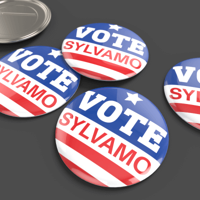 Set of 'Vote Sylvamo' buttons with red, white, and blue design on a dark background