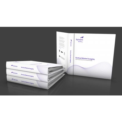 Stack of white Sylvamo vertical industry binders on a dark gray background